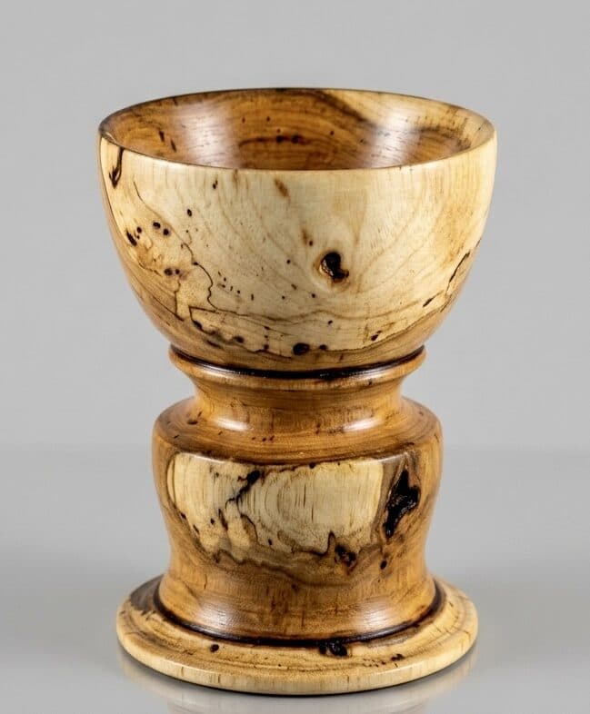 A pedestal vessel hand-turned by Shiloh N. Gray, in spalted maple.